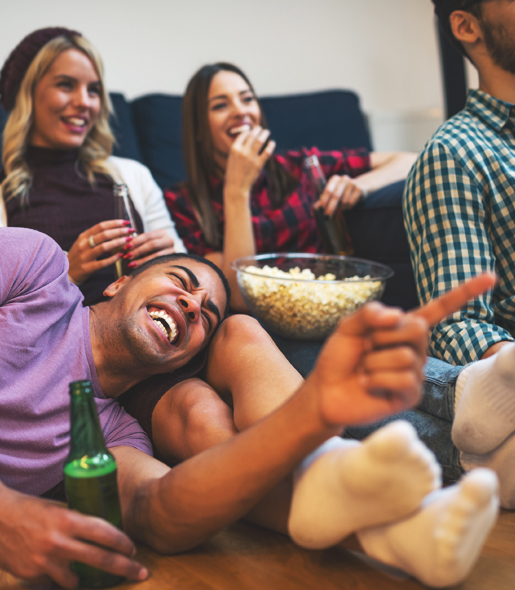 Students Laughing And Smiling At TV