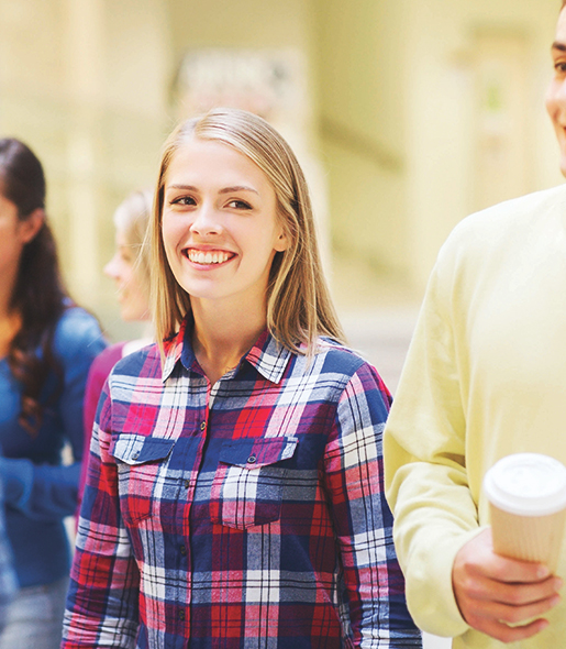 Depth of Field Shot Of Blonde Female Student Smiling