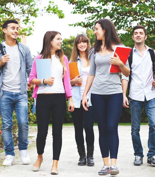 Five Students Walking and carrying Folders in Huddersfield