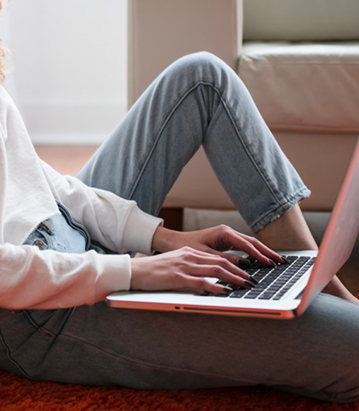 Close Up Of Students Hands Tapping At  A Laptop keyboard